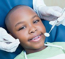Little boy receiving dental checkup