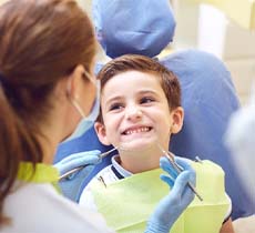 Child at dentist for fluoride treatment in Garland