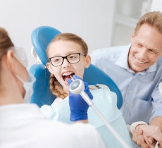 A young girl in the dentist chair