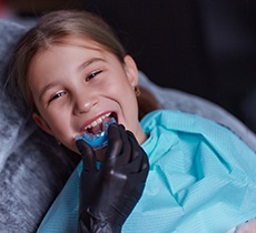 Child getting a mouthguard at the dentist