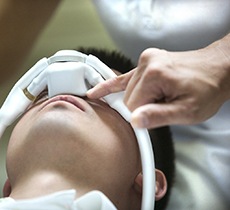 A male patient receiving nitrous oxide during an appointment in Garland