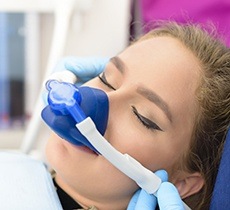 Young girl with nitrous oxide nose mask