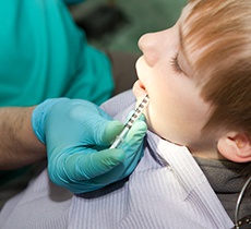 young patient relaxing in dental chair with oral conscious sedation