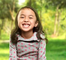 Little girl with missing teeth in Garland