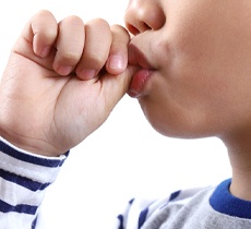 Boy sucking his thumb in Garland