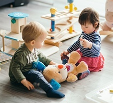 Two kids playing in waiting area