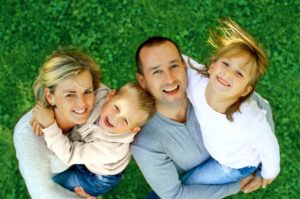 Smiling family of four. 