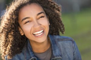 a young girl with a beautiful smile