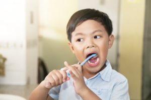 child brushing their teeth