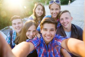 Teens enjoying summer after visiting their Garland dentist