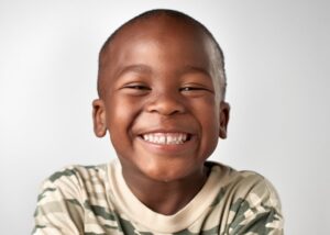 Young boy smiling. 