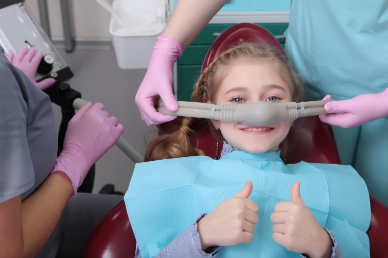 Young patient smiling at sedation dentist